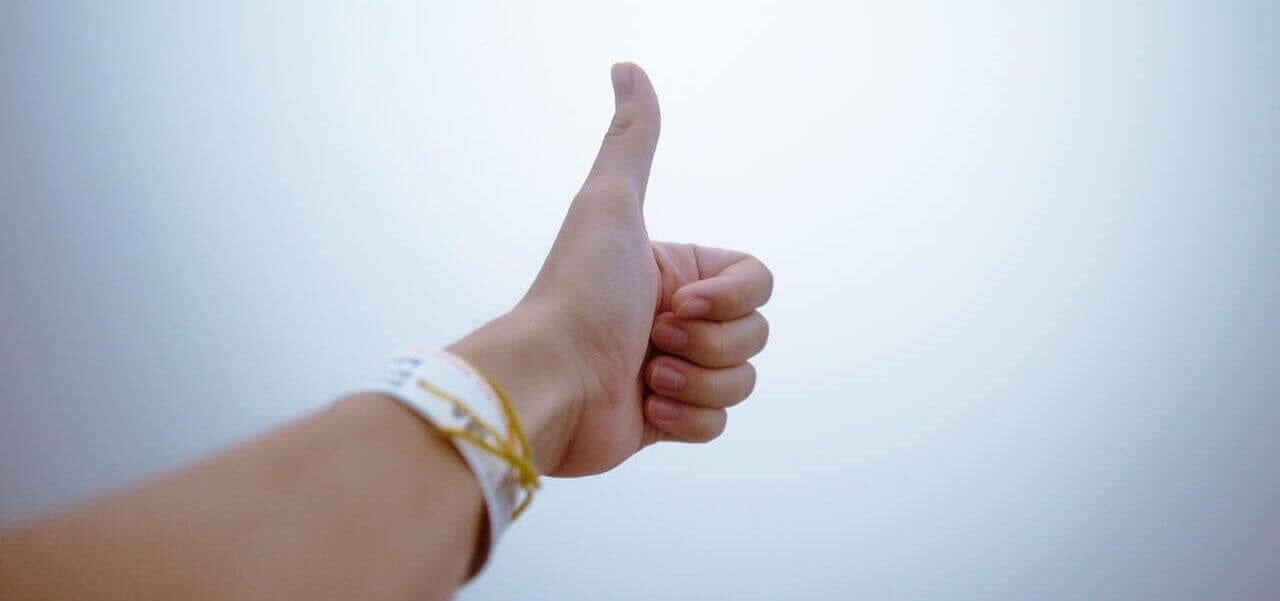 A person making a thumbs up.