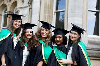 Five graduate female students posing for a picture taking.