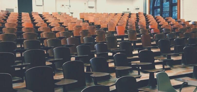Rows of chairs in a lecture hall.