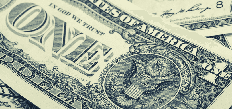 A close-up picture of a one dollar bill.