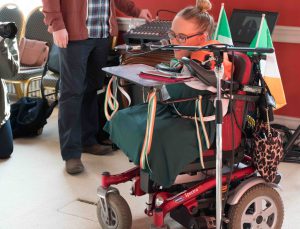 Joanne O’Riordan, a girl with no limbs, in a wheelchair giving a speech.