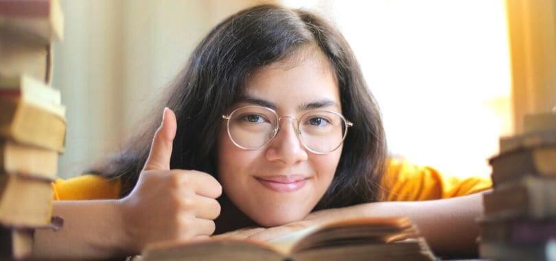 A student giving a thumbs up to the camera.