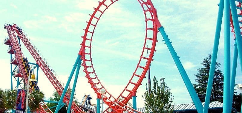 A red and blue rollercoaster with a loop.