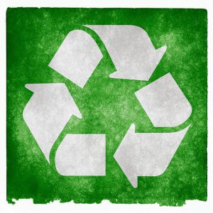 Recycle triangle symbol on a green background.