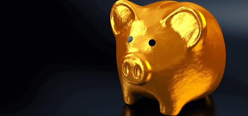 A golden piggy bank with a dark background.