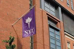 The New York University's torch logo printed on a flag.