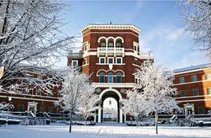 Oregon State University campus during winter with trees filled with snow.