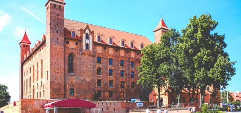 A picture of a red-bricked college campus building.