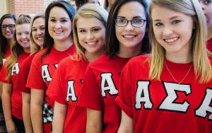 Alpha girls from Henderson  State University are lining up and smiling.