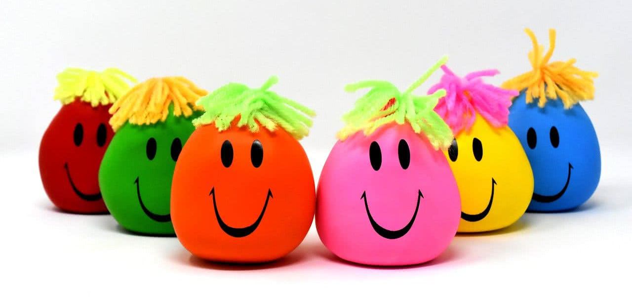 Six stress balls with smiley faces.