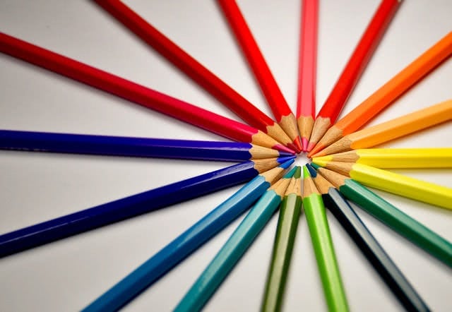 Colored pencils pointing to each other in a circular formation.