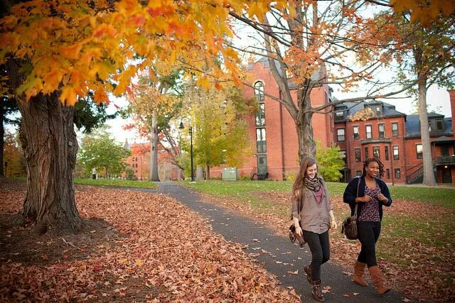 Students on campus in fall -- November is national scholarship month