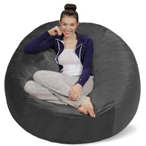 A student sitting in her grey Sofa Sack bean bag chair. Click to view its Amazon page.