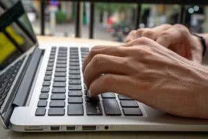 Student typing on computer, wondering "what are some things admissions officers don't like"