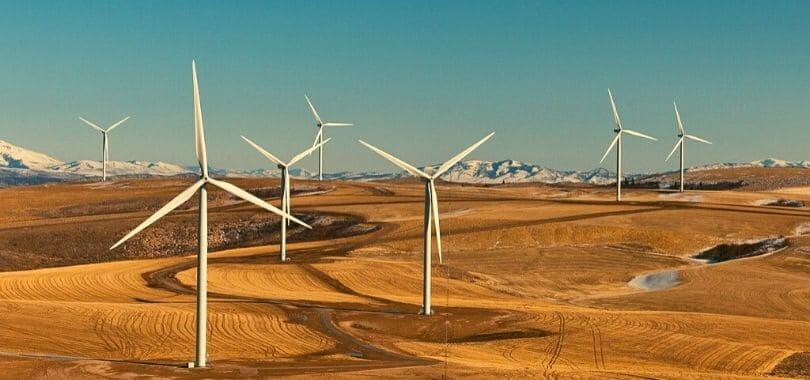 A wind farm spanning across multiple hills.