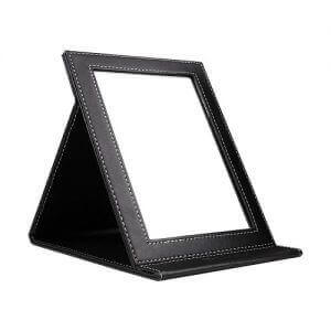 A leather-bound folding mirror by DUcare. Image linked to its Amazon page.